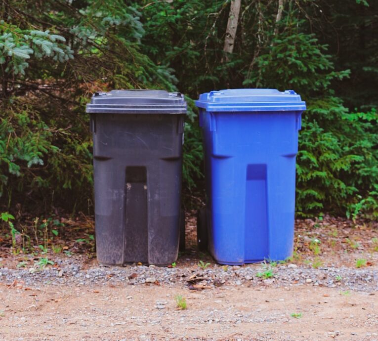 green and blue trash bins